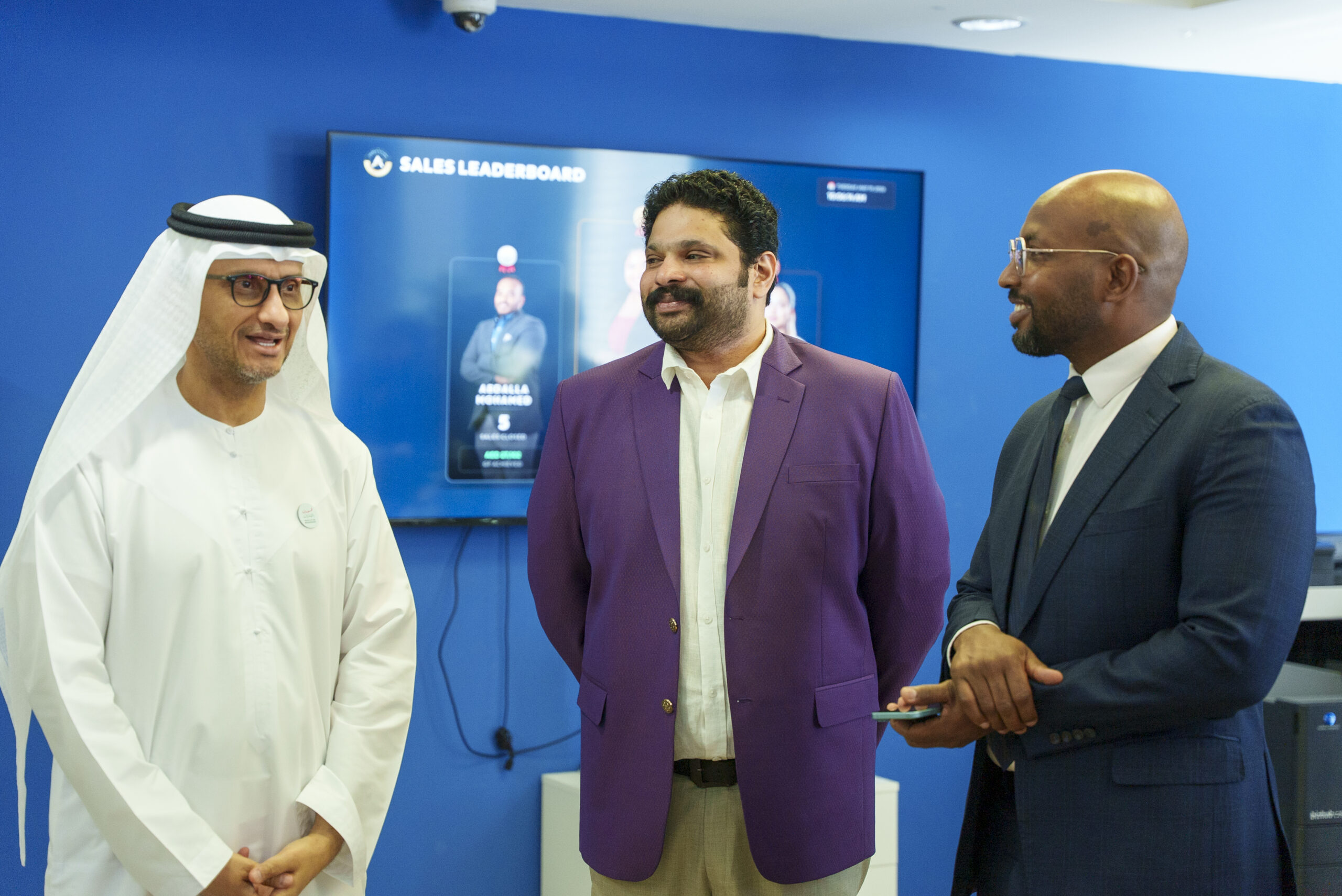Masdar City Abu Dhabi official in discussion with A&A Business Setup Experts team members at Dubai office