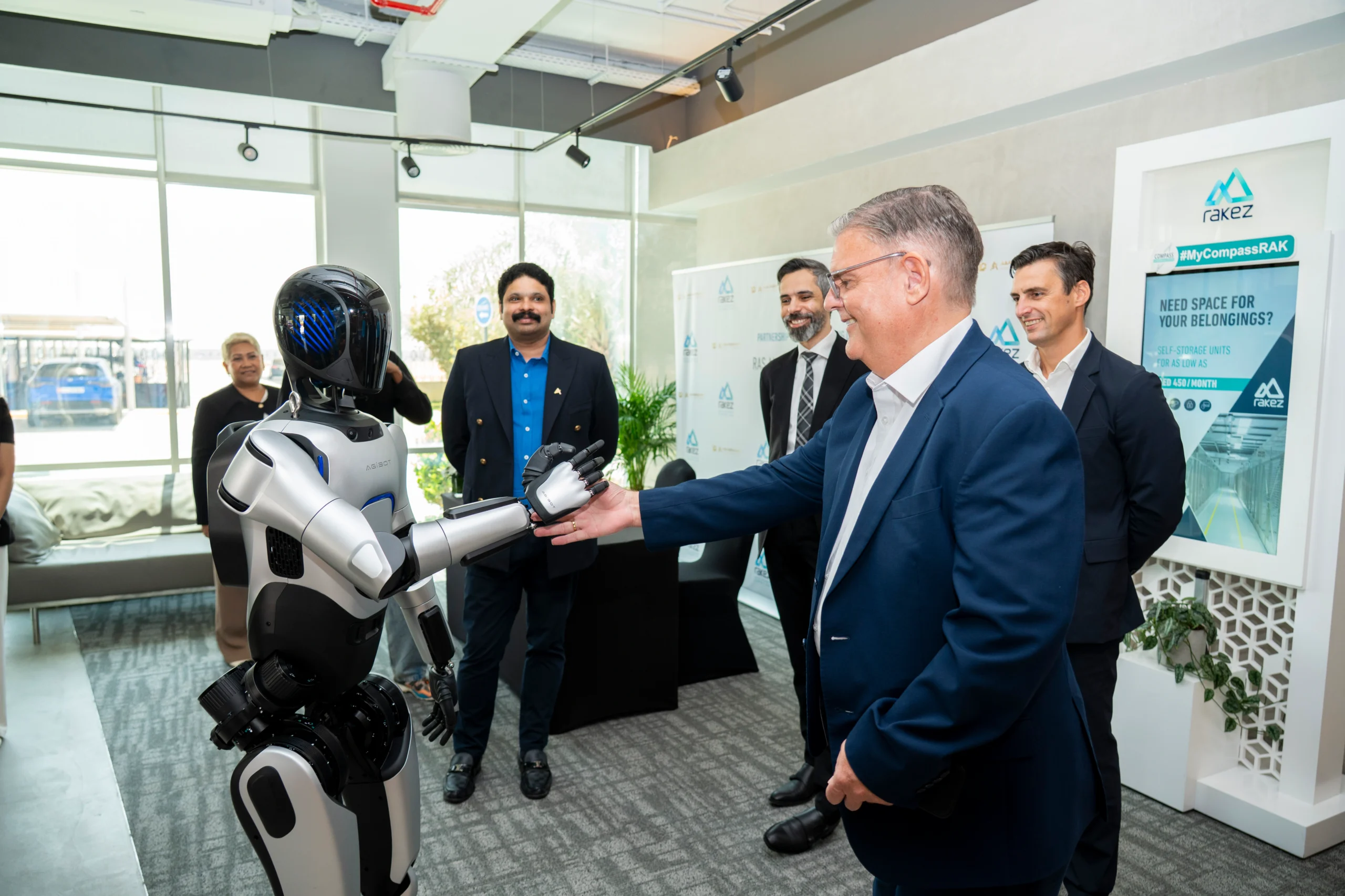 Distinguished guests interacting with AI technology