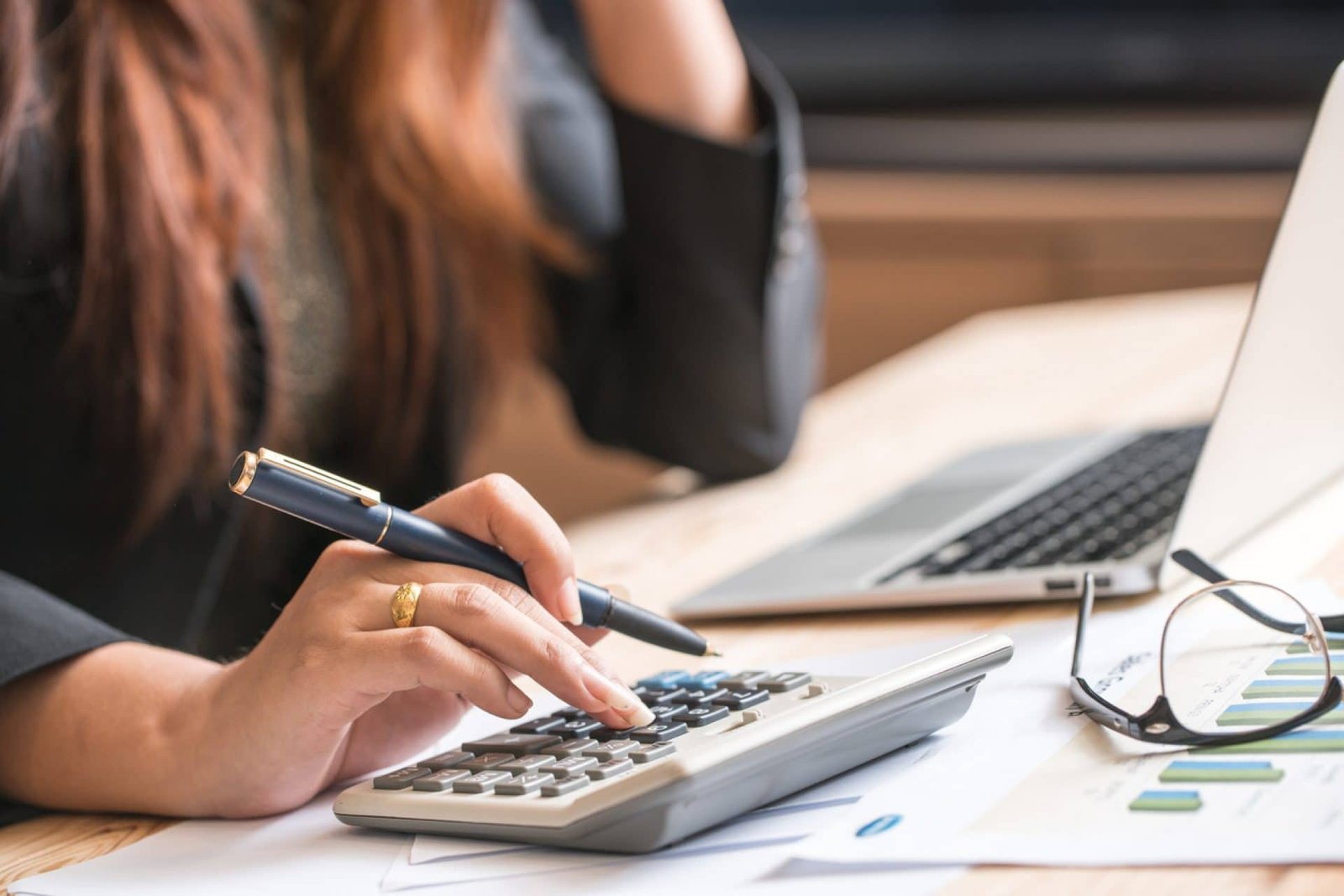 finances-saveing-economy-concept-female-accountant-banker-use-calculator